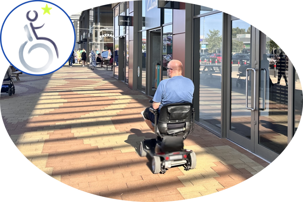 man on mobility scooter in front of shops